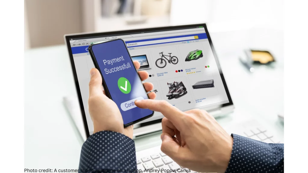 A photo showing a customer shopping online on a laptop