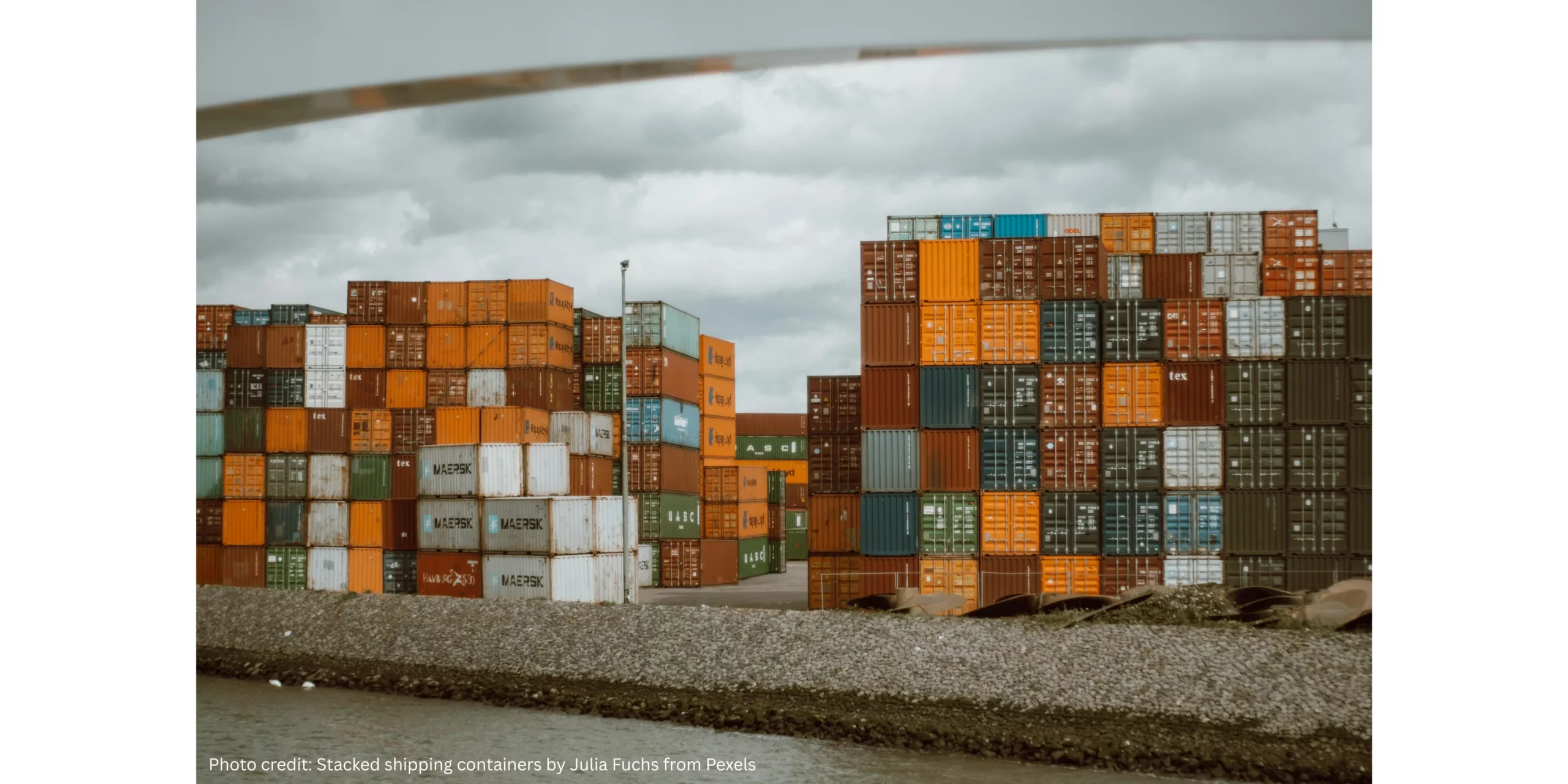 An image showing stacked shipping containers in a port